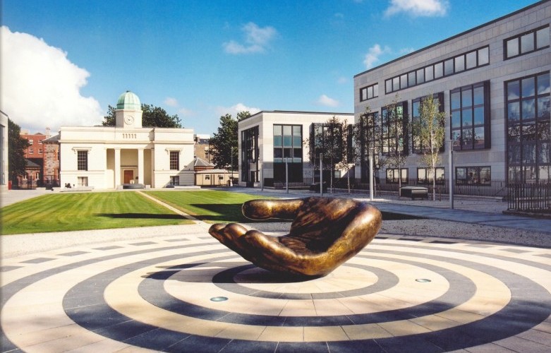 A bronze statue of an open hand outside the Department of Education