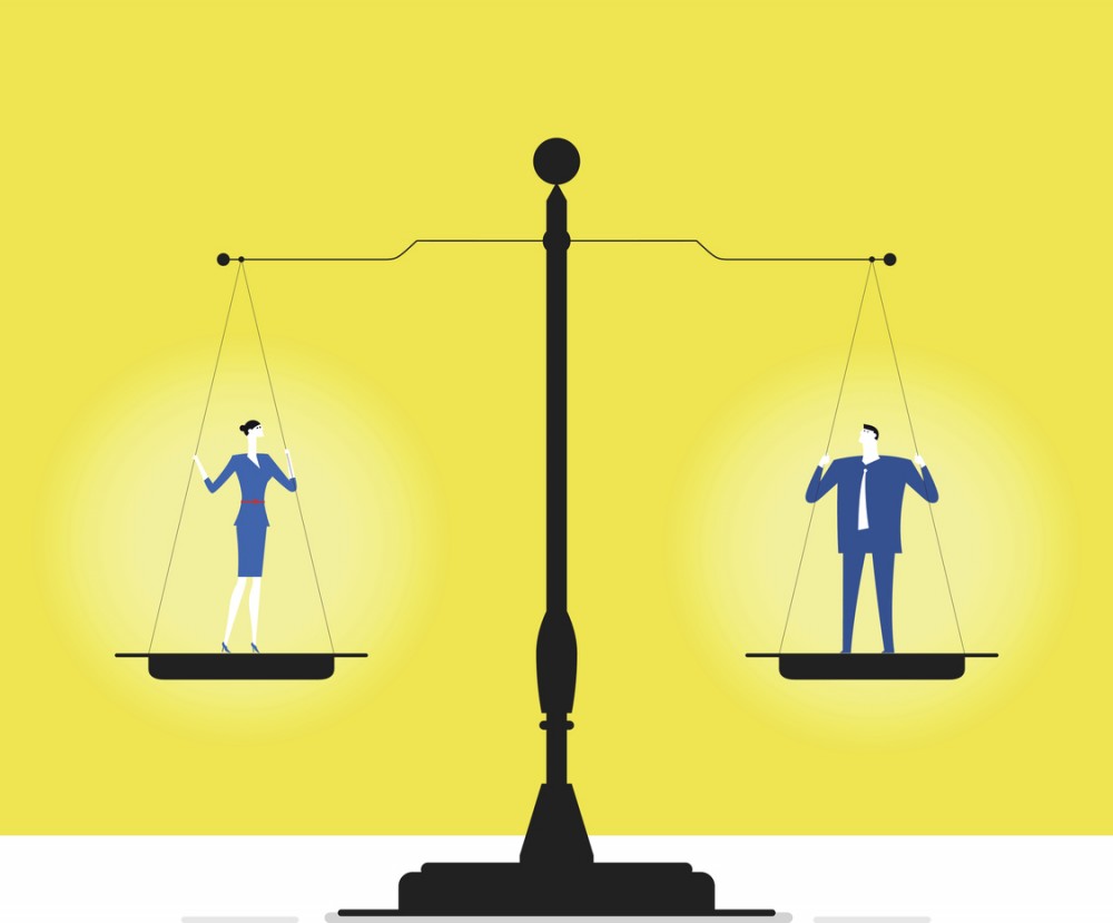 An illustration of a man and a woman standing on either plate of an old fashioned weighing scale. They both weigh equal amounts.