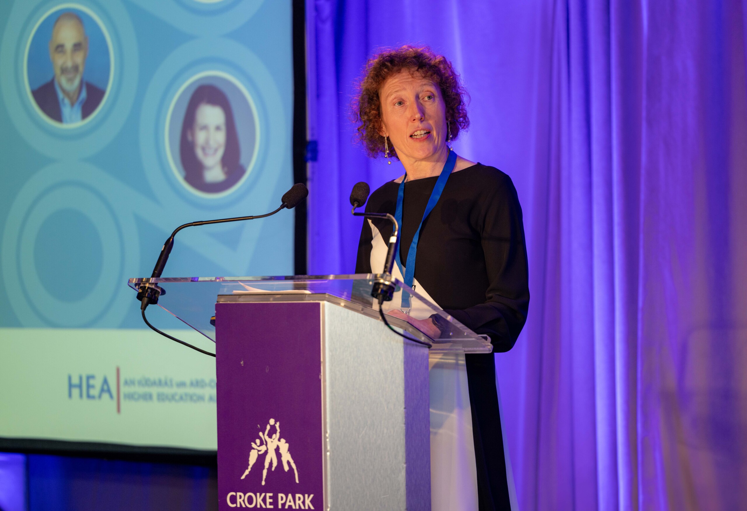 Caitríona Ryan of the Higher Education Authority (HEA) speaking on a podium at the North South Research Programme Conference, 2024 at Croke Park, Dublin.