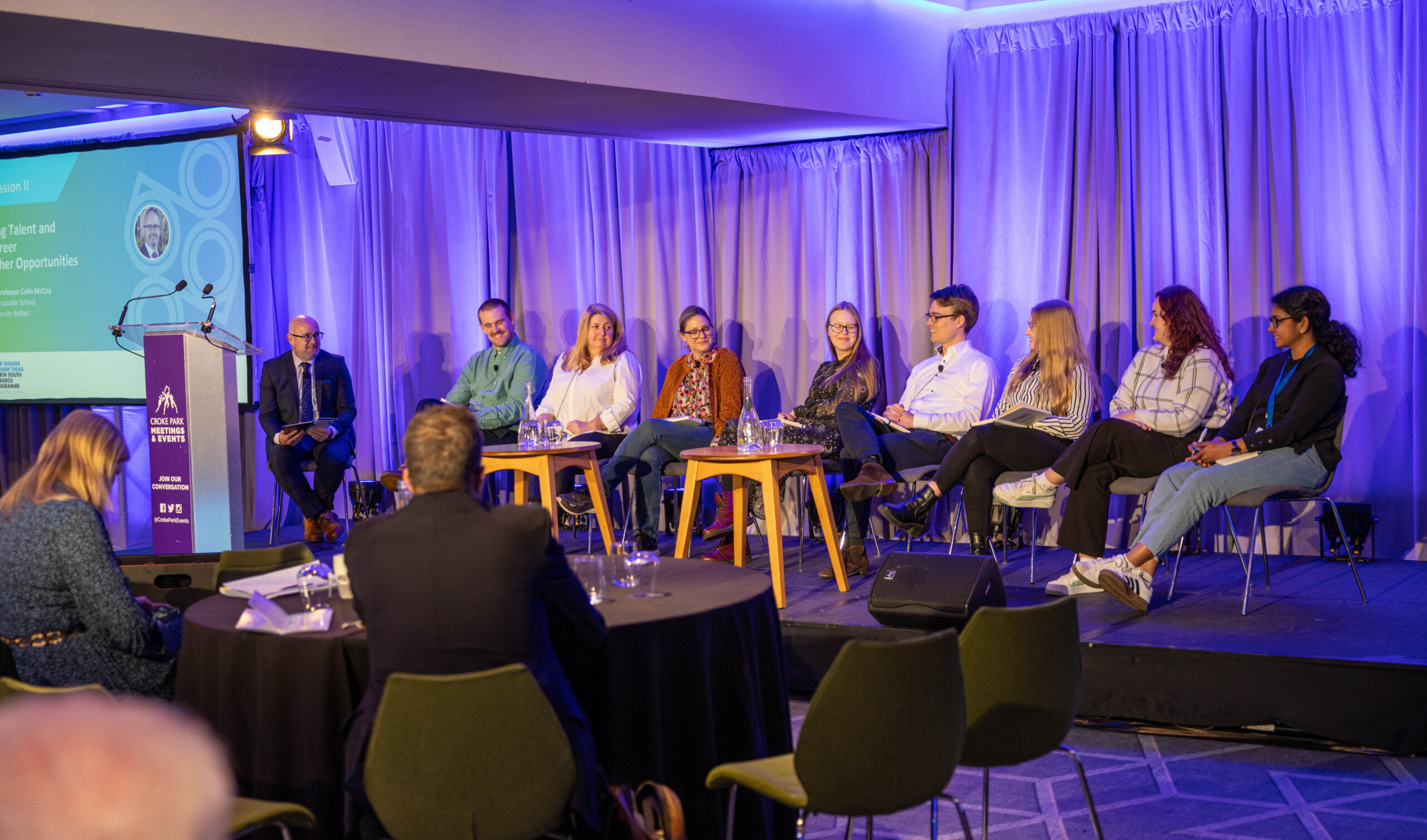 Panel discussion on stage at the North South Research Programme Conference 2024 at Croke Park, Dublin.