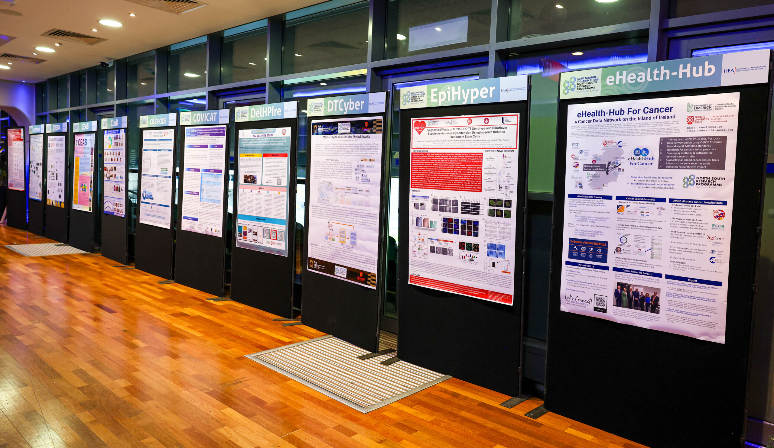 Image of a number of information boards at the North South Research Programme Conference 2024.