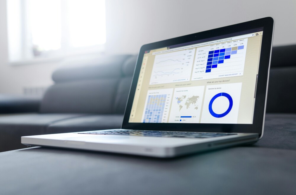 A laptop showing sample graphs on the screen