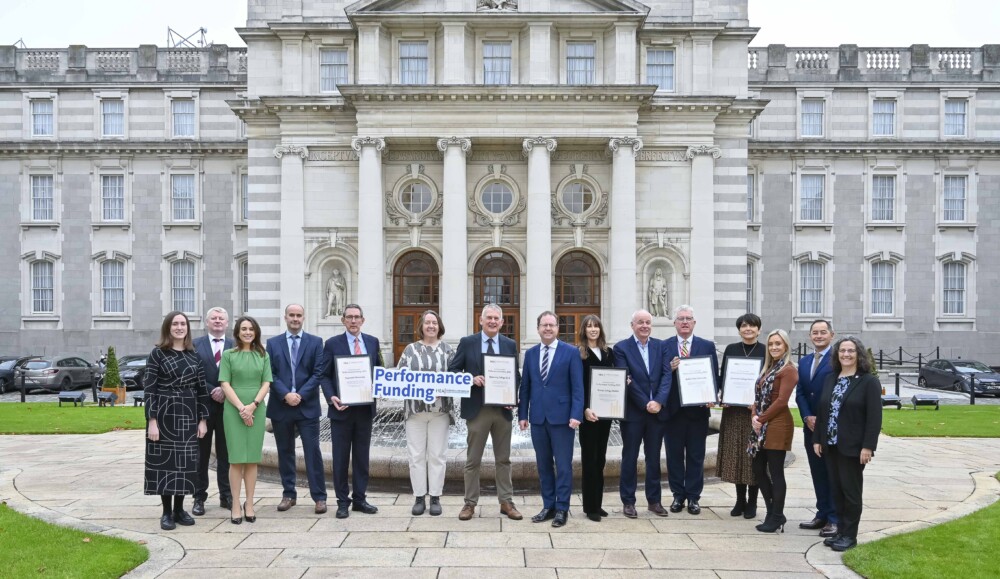 Performance Funding 2025 Press Release with group of people in front of building