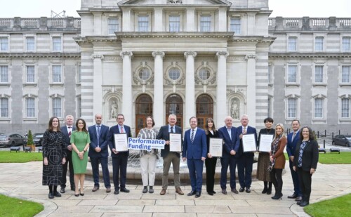 Performance Funding 2025 Press Release with group of people in front of building