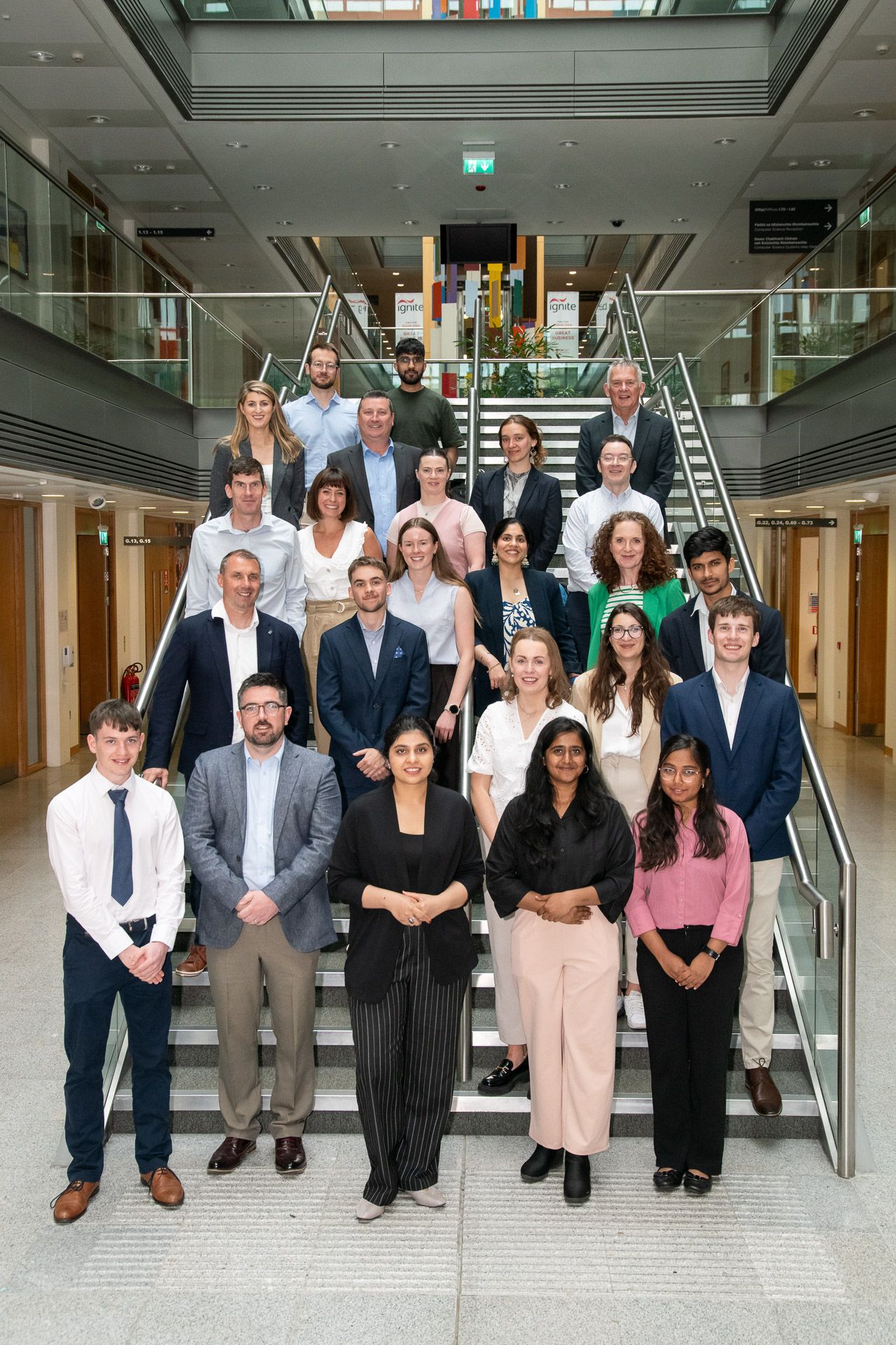 Group of people standing on a staircase in UCC for the UCC Student Awards