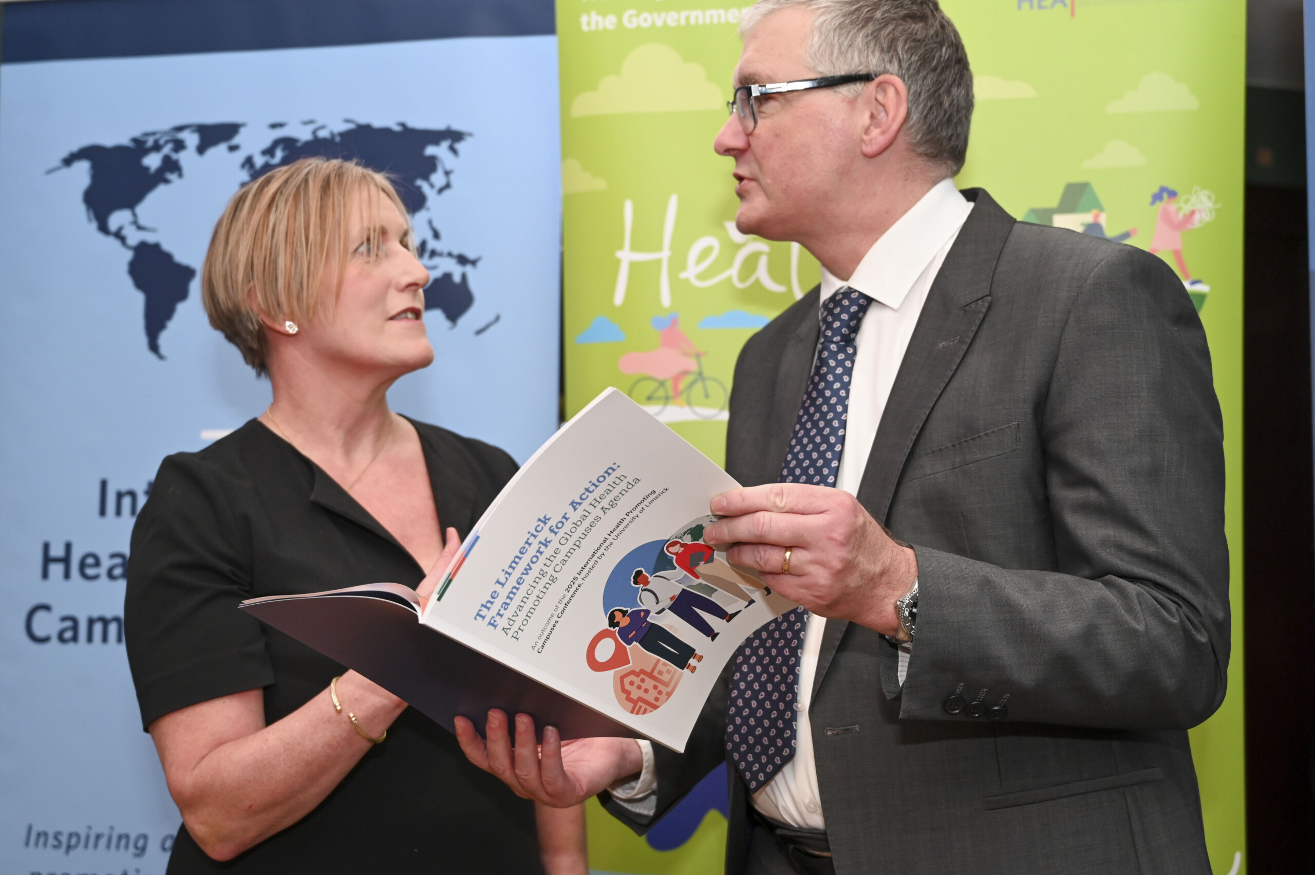 Two people discussing the Launch of the Limerick Framework for Action booklet