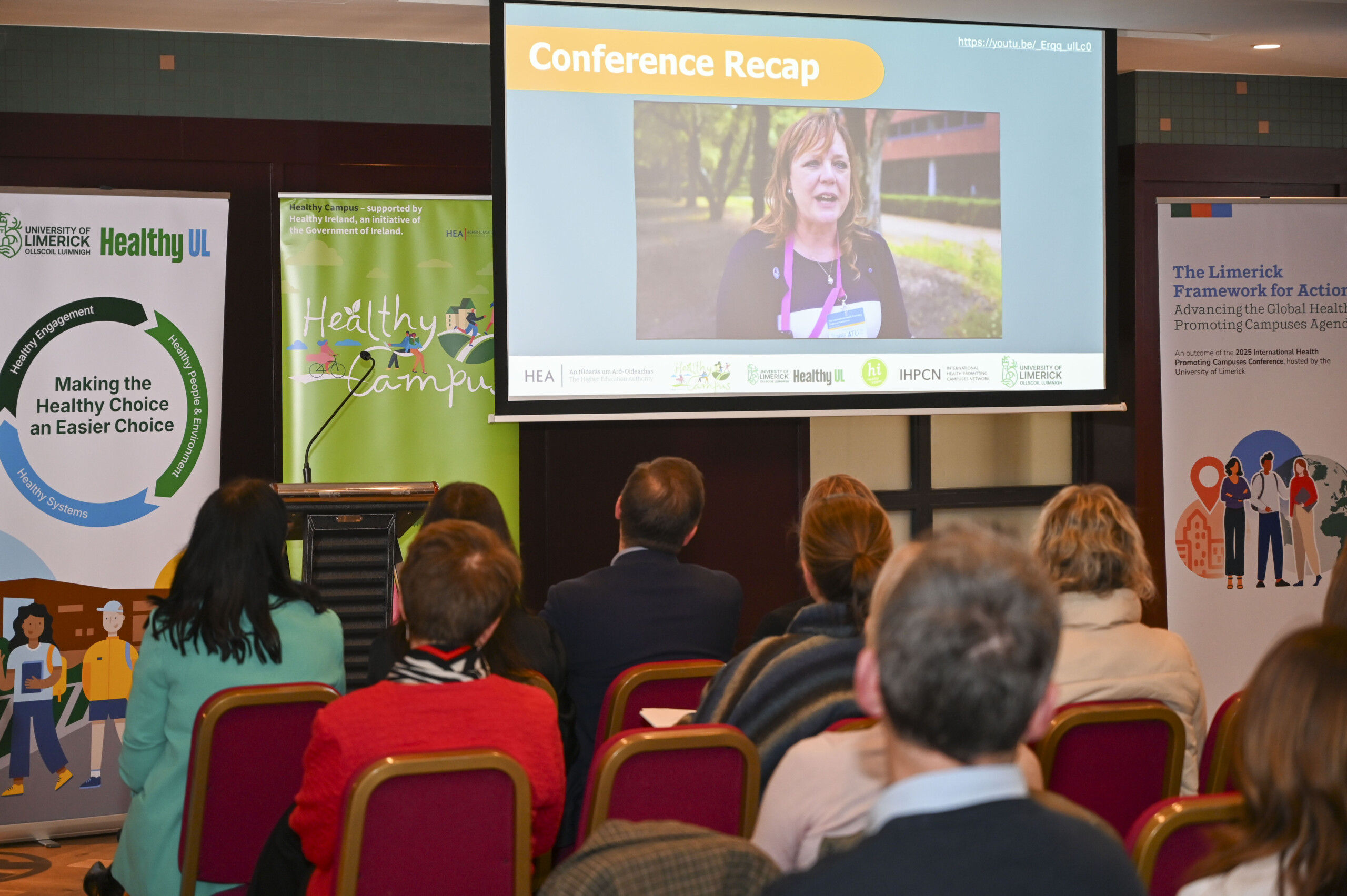 Group of people looking at a presentation at the launch of the Limerick Framework for Action