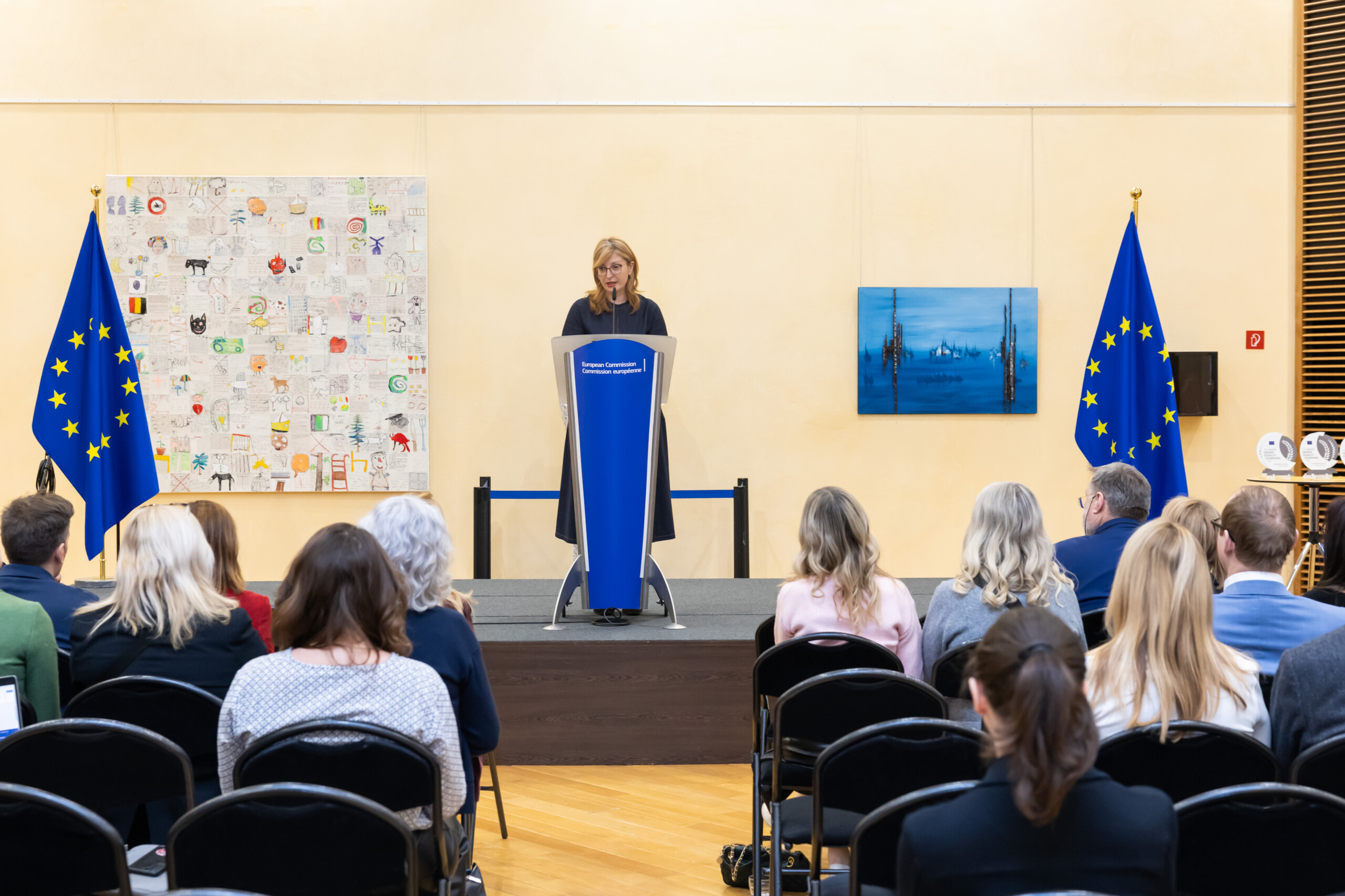 Woman presenting in front of crowd at the European Gender Equality Champion Prize giving ceremony