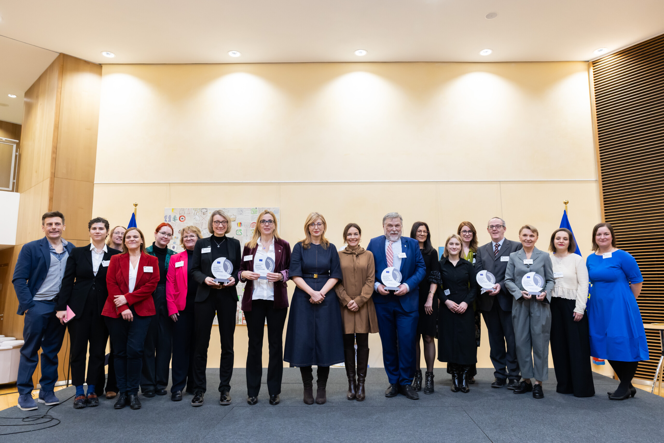 Group of people standing holding awards at the European Gender Equality Champion Prize giving ceremony in Brussels