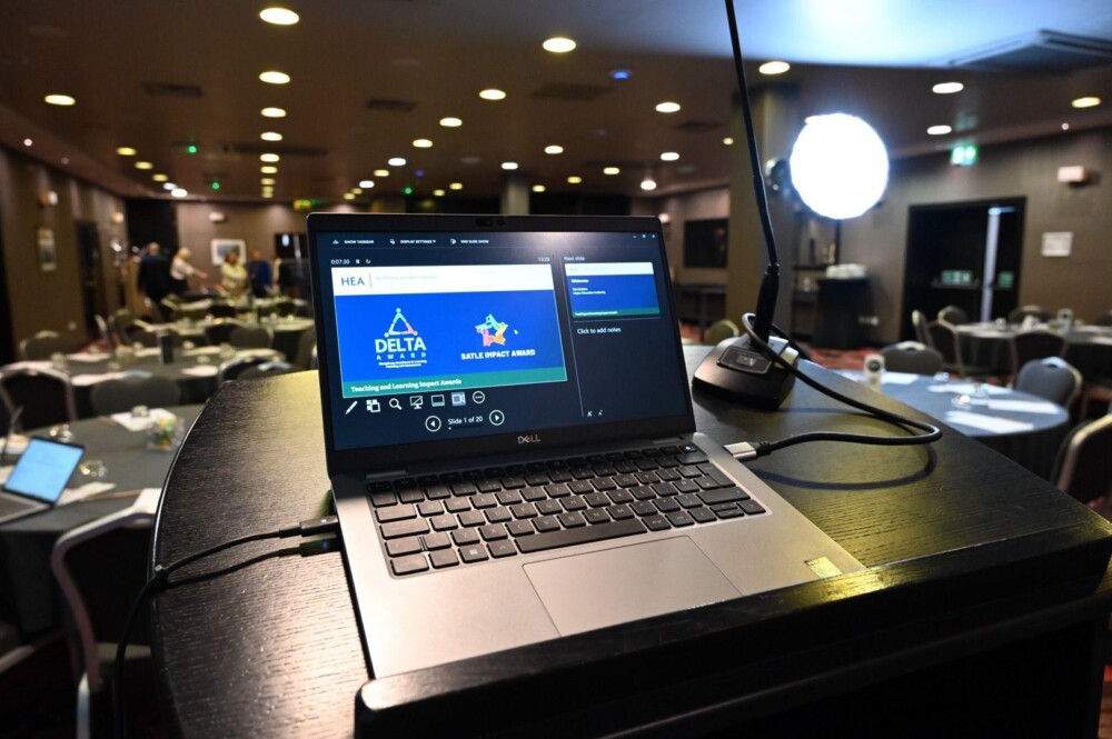 A laptop screen displaying information about the HEA Teaching and Learning Impact Awards