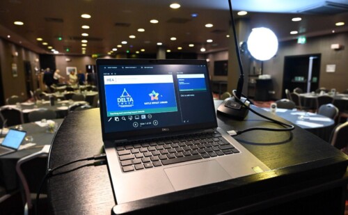 A laptop screen displaying information about the HEA Teaching and Learning Impact Awards