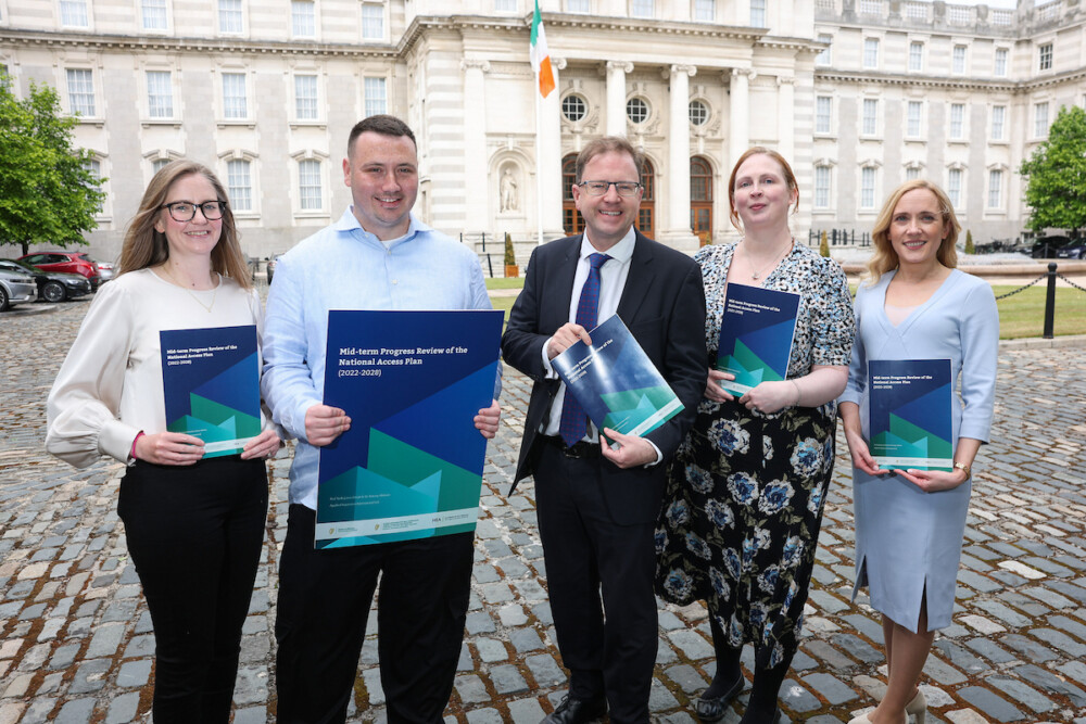 Group of people launching the Mid-term Progress Review of the National Access Plan (2022-2028)