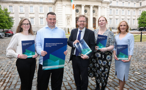 Group of people launching the Mid-term Progress Review of the National Access Plan (2022-2028)