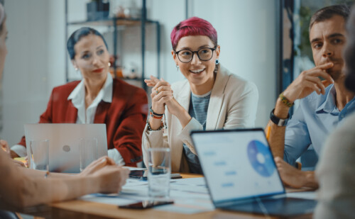image of three people sitting in a meeting
