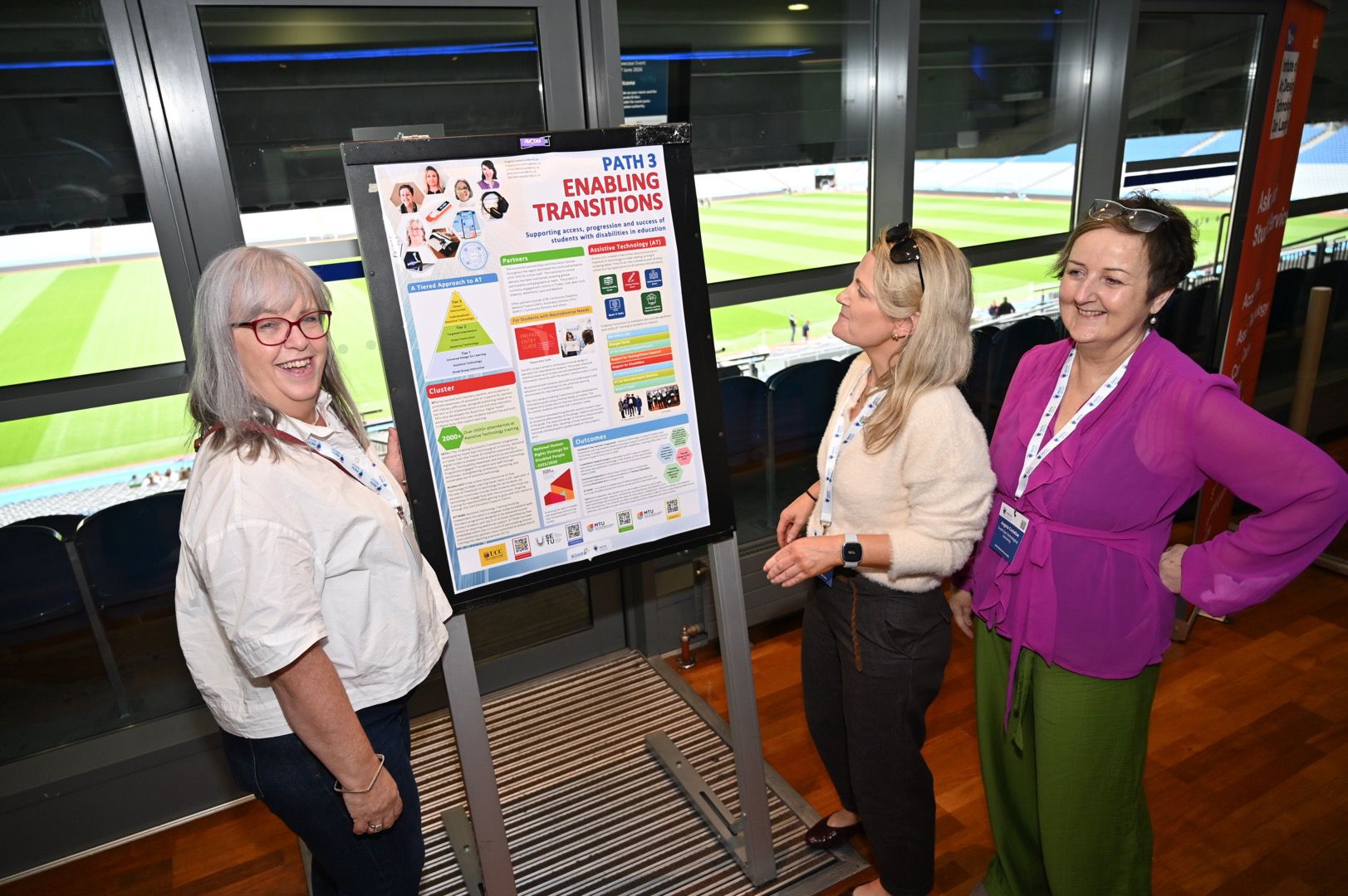 Group standing by poster at PATH Showcase 2026 event in Croke Park