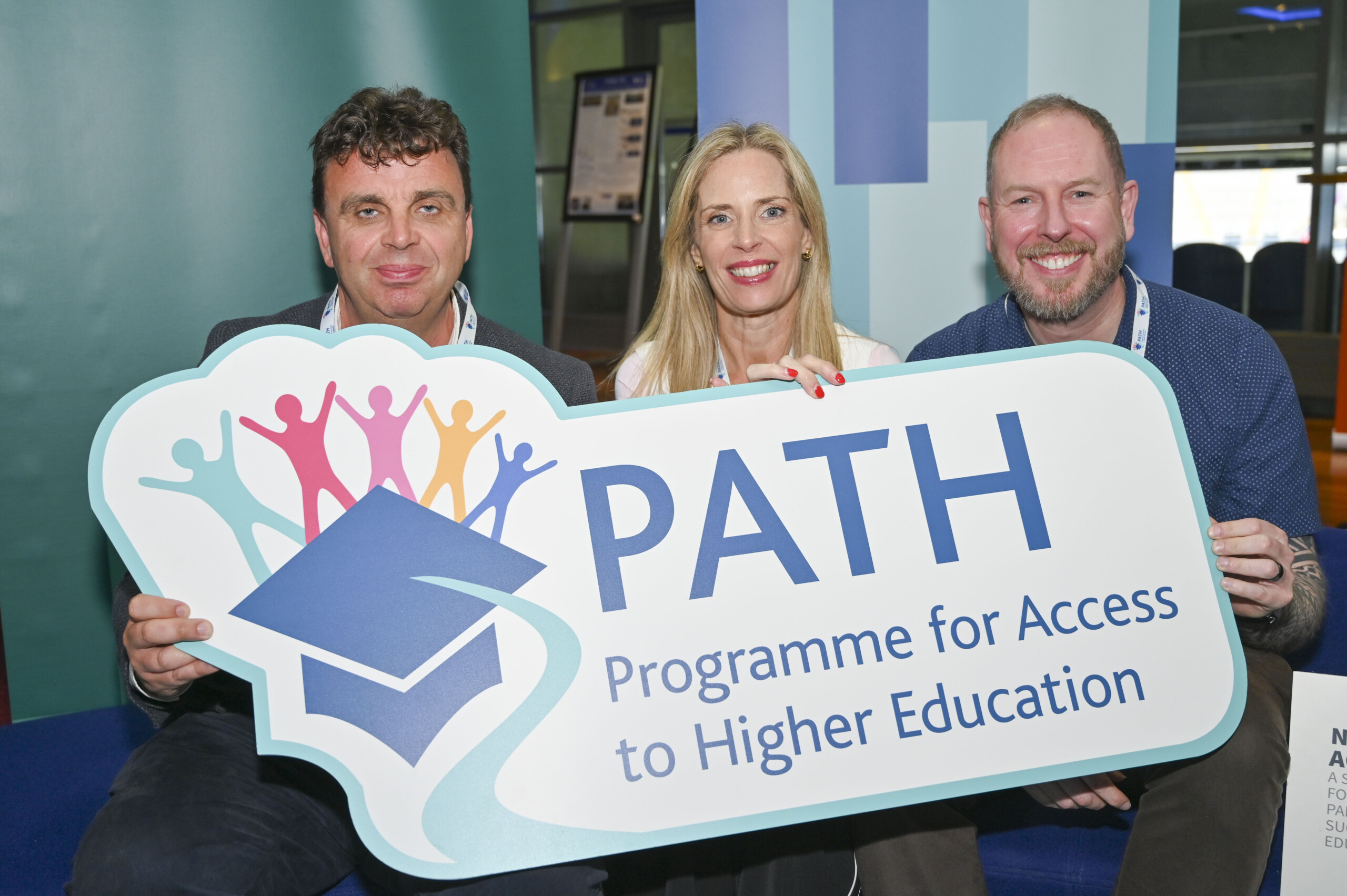 Group of participants holding a PATH banner at the PATH Showcase Event 2026