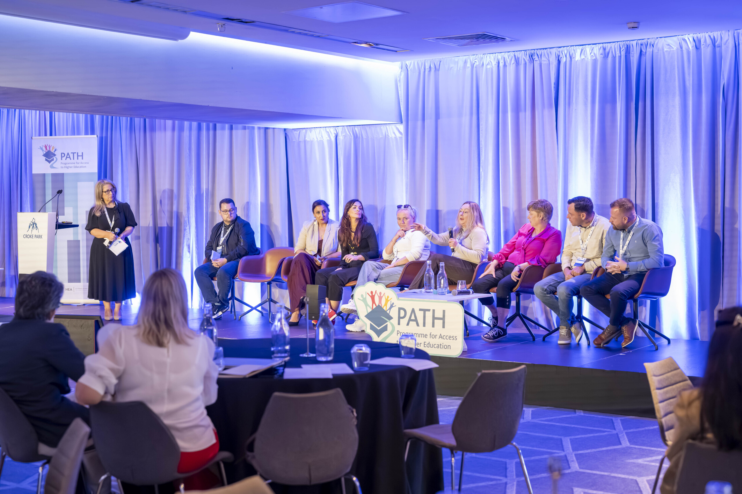 Panel on stage at PATH 2026 event