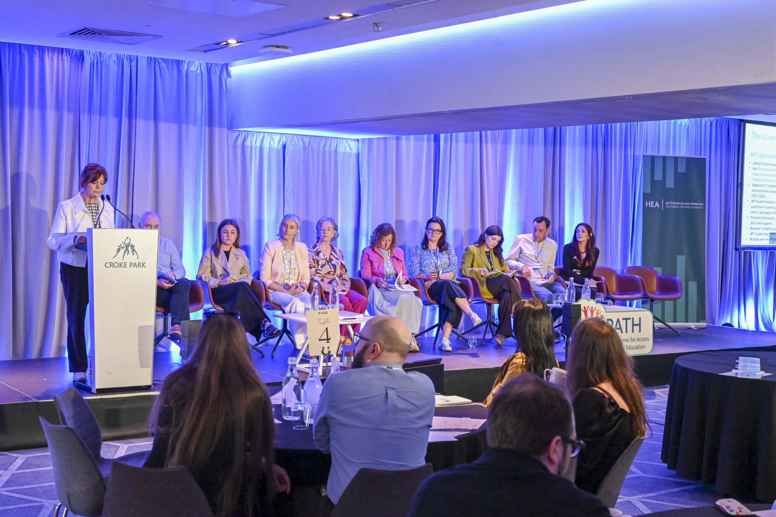 Panel on stage at PATH 2026 event