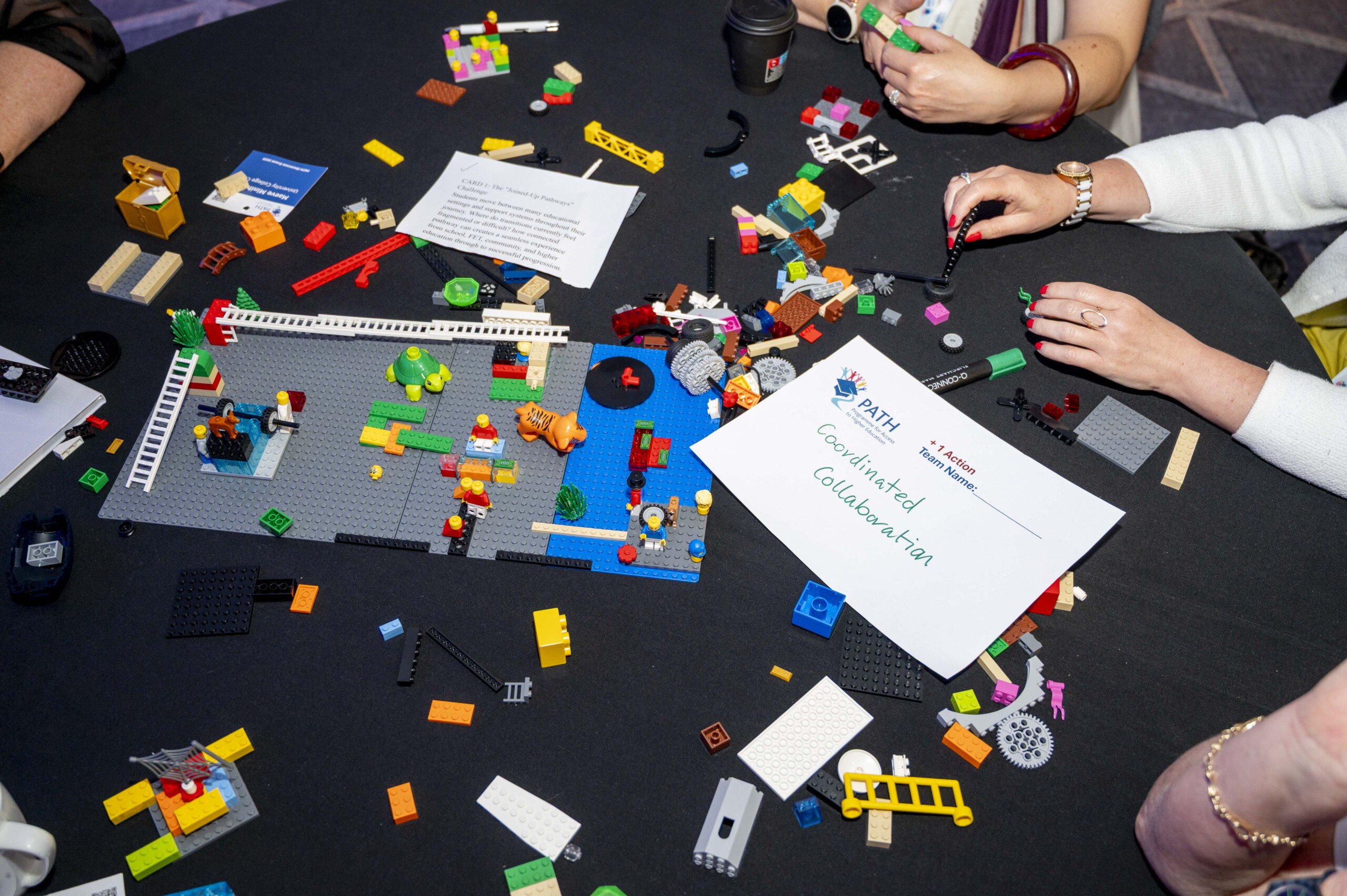 Group playing with lego at the PATH Showcase Event 2026