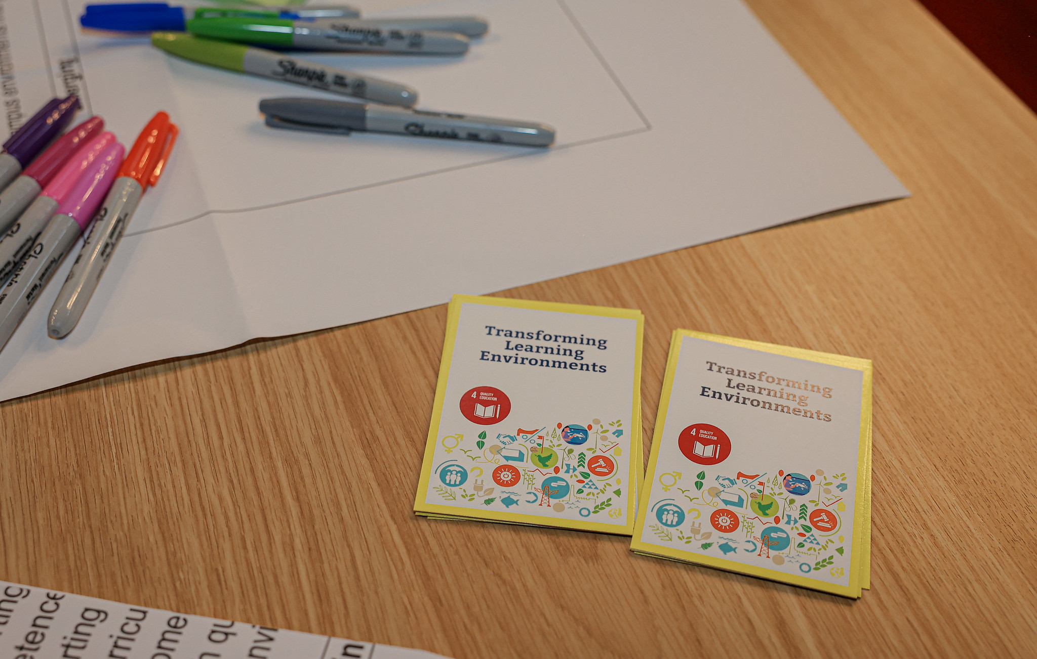Markers and leaflets on a table